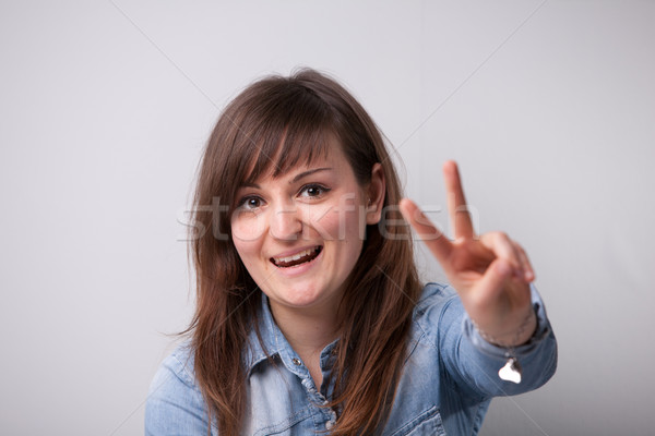 ordinary successful girl showing off fingers Stock photo © Giulio_Fornasar