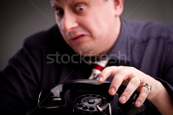 Stock photo: clerk scared of phone call