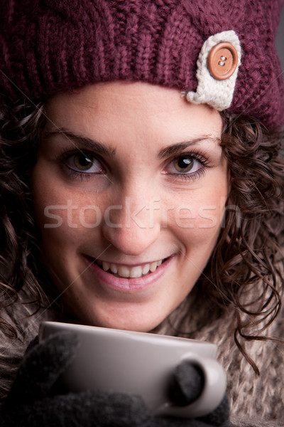 smiling woman with a mugful of a hot drink Stock photo © Giulio_Fornasar