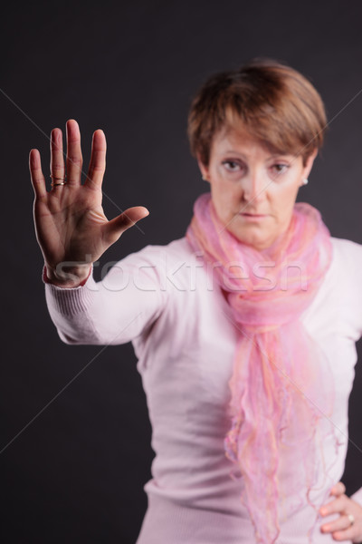 mature woman with a raised open hand Stock photo © Giulio_Fornasar