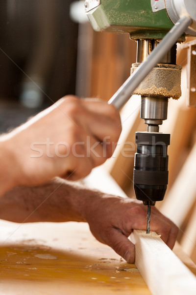 woodworker drilling a plank with machinery Stock photo © Giulio_Fornasar