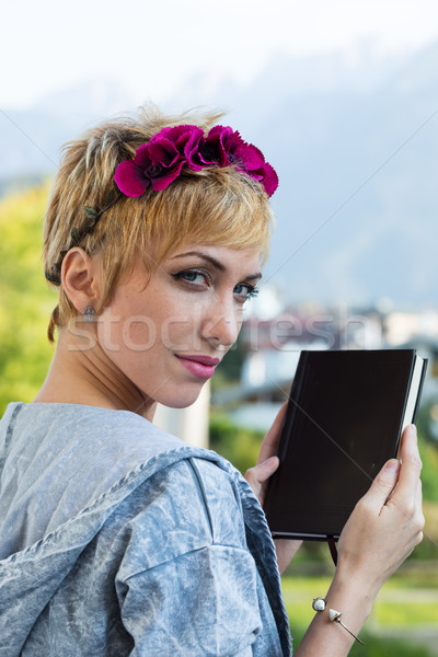 young woman with flowered headband holding a book Stock photo © Giulio_Fornasar
