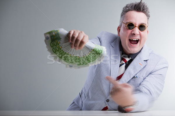 man pointig banknotes in his hand Stock photo © Giulio_Fornasar