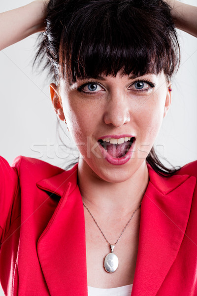 Singing or yelling woman with hands in hair Stock photo © Giulio_Fornasar