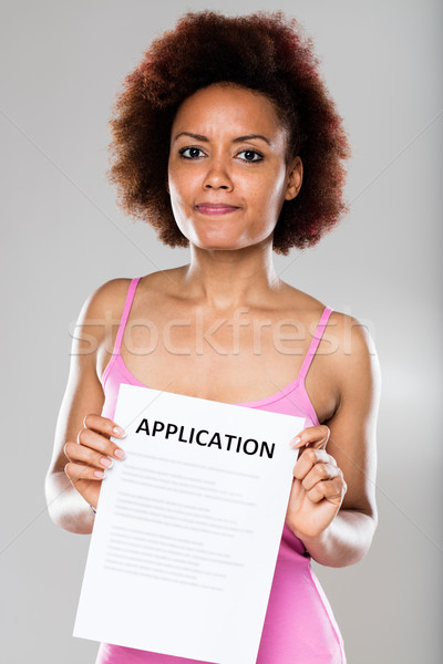 suspicious woman with an application form  Stock photo © Giulio_Fornasar