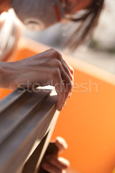 Woman polishing a window with sand Stock photo © Giulio_Fornasar