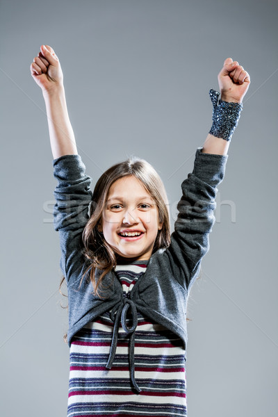 little girl rising up her arms joyfully Stock photo © Giulio_Fornasar