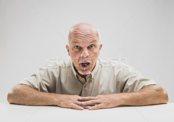 Senior man gawping at the camera in astonishment Stock photo © Giulio_Fornasar
