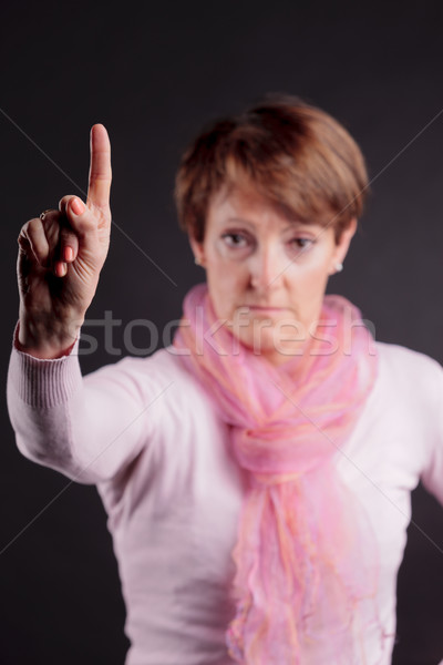 mature woman with a raised hand saying NO Stock photo © Giulio_Fornasar
