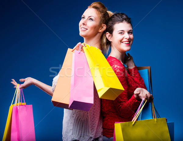 Vrouwen winkelen zakken Blauw twee vrouwen kleurrijk Stockfoto © Giulio_Fornasar