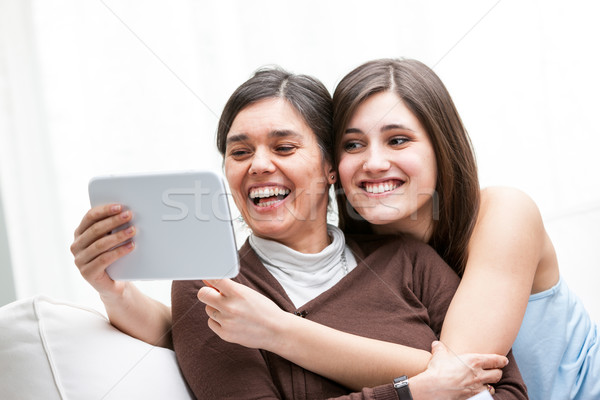 Mother and daughter laughing as they take a selfie Stock photo © Giulio_Fornasar