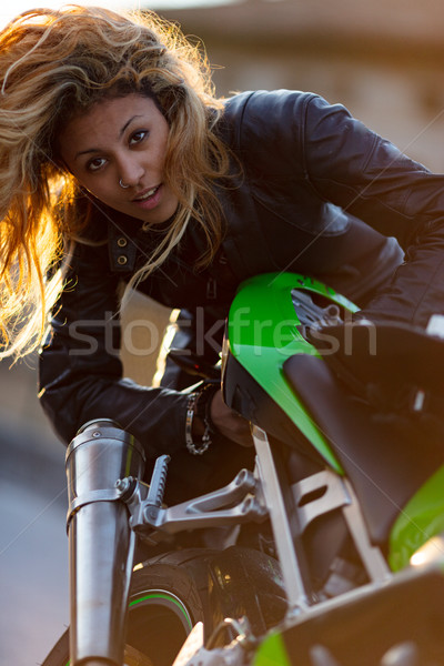 woman setting up her motorcycle to run Stock photo © Giulio_Fornasar