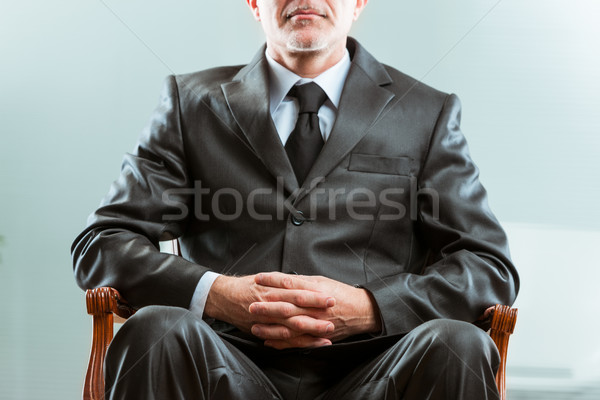 Stock photo: anonymous chairman on his chair