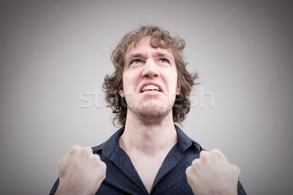 bad man expressing anger with face and hands Stock photo © Giulio_Fornasar