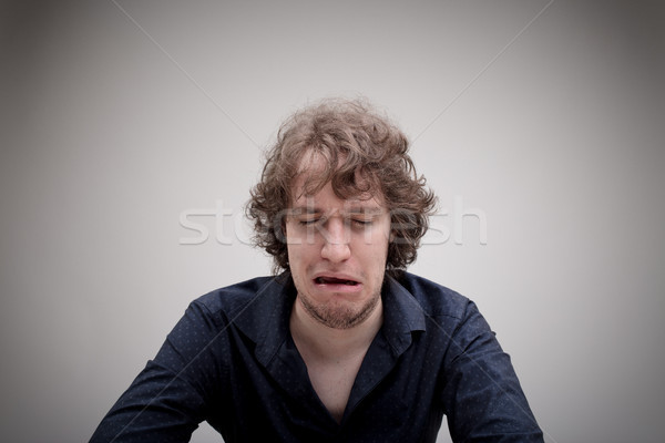 Triest man huilen beneden wanhoop jonge man Stockfoto © Giulio_Fornasar