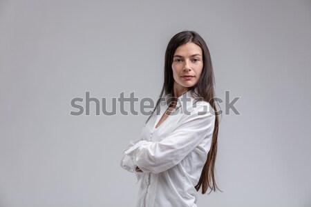 Long-haired brunette woman with arms crossed Stock photo © Giulio_Fornasar