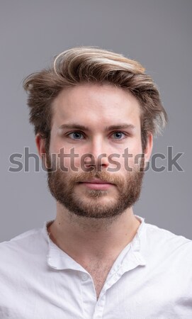 Portrait of a handsome young bearded man thinking Stock photo © Giulio_Fornasar