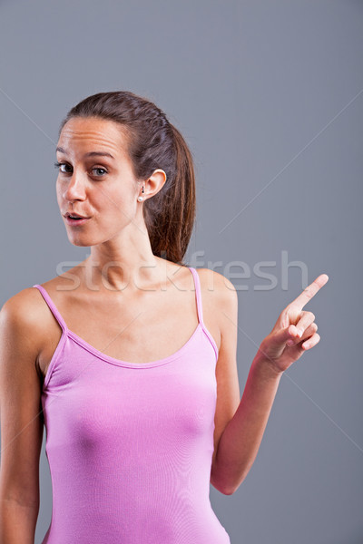Stock photo: woman pointing out with finger