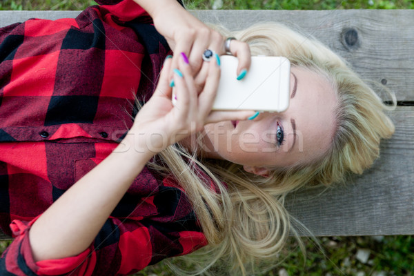 eye of a girl spotting you from behind the phone Stock photo © Giulio_Fornasar