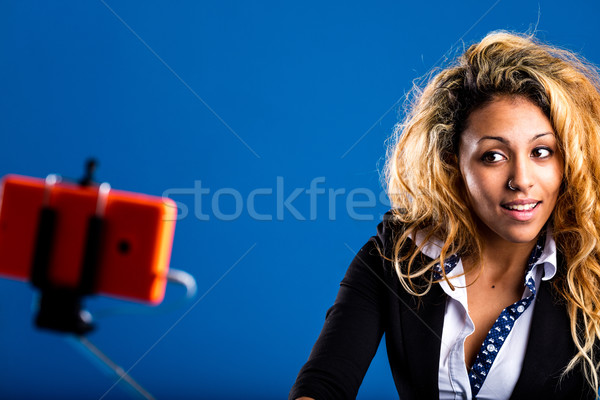 afro-american woman taking selfies with a selfie-stick Stock photo © Giulio_Fornasar