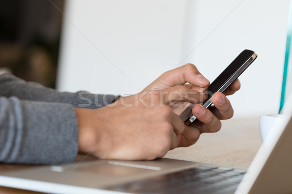 Unrecognizable male typing on cell screen Stock photo © Giulio_Fornasar