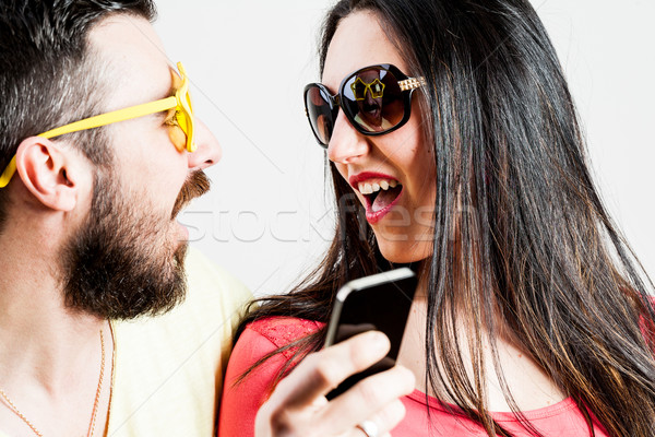 thrilled couple taking mobile photographs and selfies Stock photo © Giulio_Fornasar