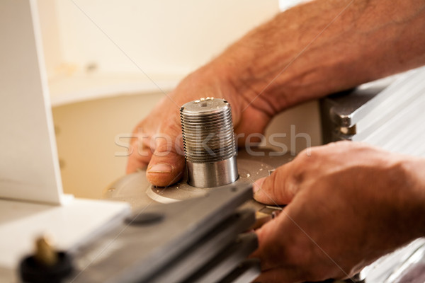 hand of a woodworker setting up a milling cutter Stock photo © Giulio_Fornasar