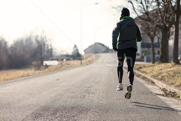 rearview of a woman running in the suburbs Stock photo © Giulio_Fornasar