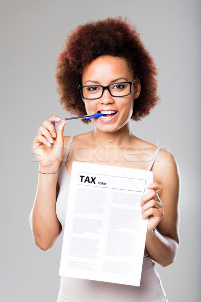 taxes are not a problem for this young woman Stock photo © Giulio_Fornasar