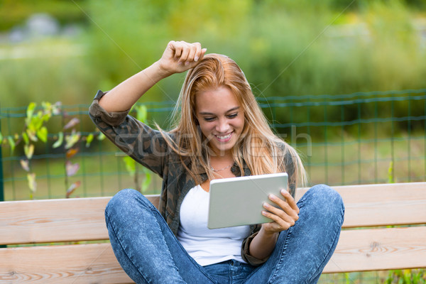 happy girl outdoors with a tablet Stock photo © Giulio_Fornasar