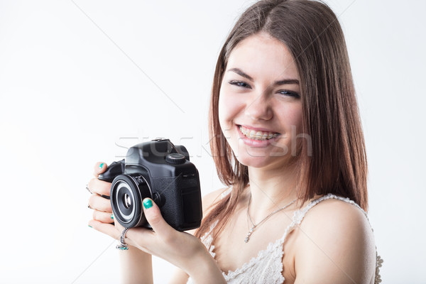 Genç kadın pantolon askısı refleks kamera kız gülen Stok fotoğraf © Giulio_Fornasar