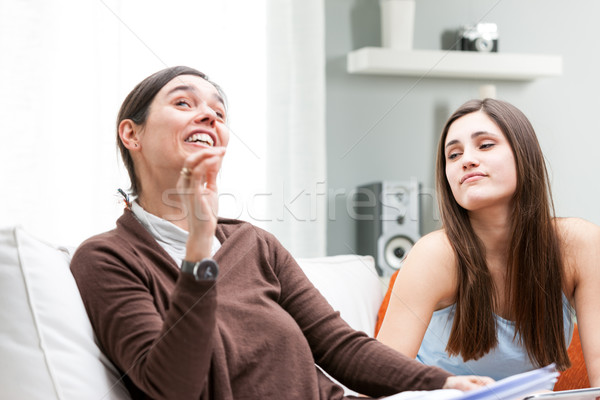 Mother and daughter having an animated talk Stock photo © Giulio_Fornasar