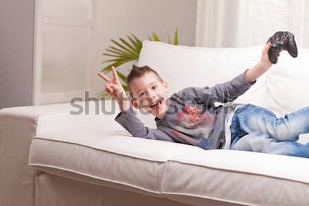 very serious woman thinking on a sofa Stock photo © Giulio_Fornasar