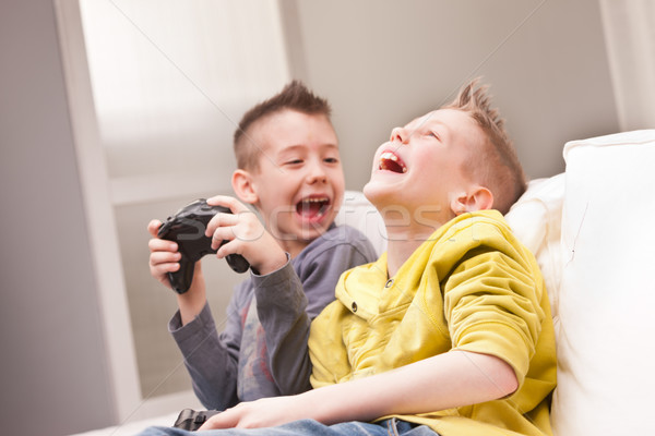 two kids playing video games Stock photo © Giulio_Fornasar