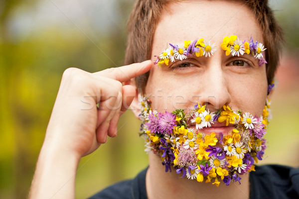 hipster face-covered with flowers thinking Stock photo © Giulio_Fornasar