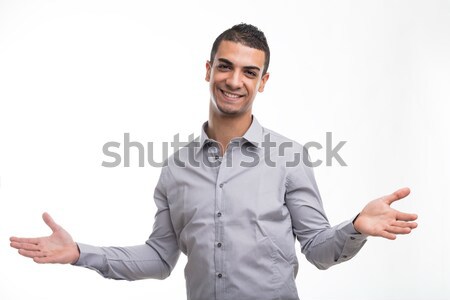 Young cheerful man with open arms gesture Stock photo © Giulio_Fornasar