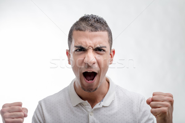 Emotional man yelling and clenching his fists Stock photo © Giulio_Fornasar