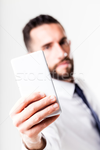 businessman with smartphone solving the whole thing Stock photo © Giulio_Fornasar