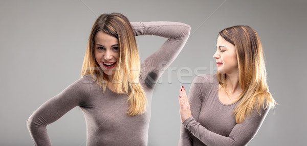 Stock photo: woman disgusted by body odor