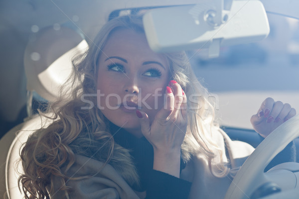 beautiful girl checking her makeup in her car Stock photo © Giulio_Fornasar