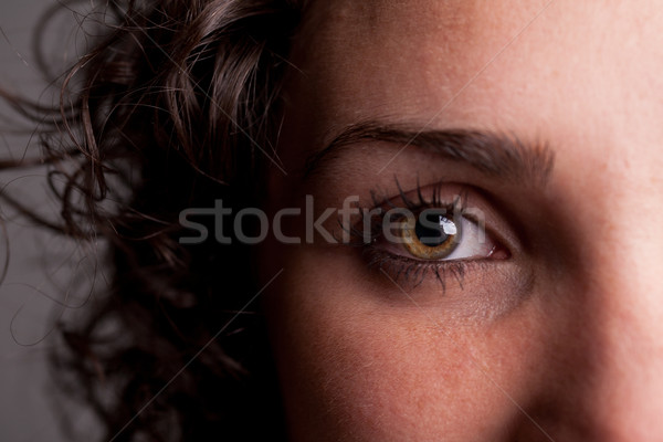 closeup of an eye of a curly haired girl Stock photo © Giulio_Fornasar