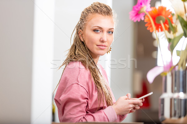 Pretty stylish young woman holding a mobile Stock photo © Giulio_Fornasar