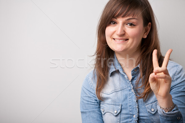 ordinary successful girl showing off fingers Stock photo © Giulio_Fornasar