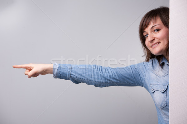 girl pointing out with her entire arm Stock photo © Giulio_Fornasar