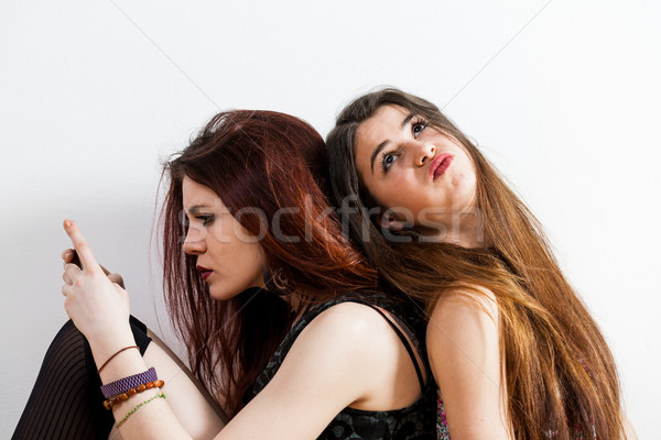 girl bored by her friend ignoring her Stock photo © Giulio_Fornasar