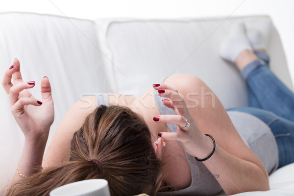 very stressed reaction of a girl on her sofa Stock photo © Giulio_Fornasar