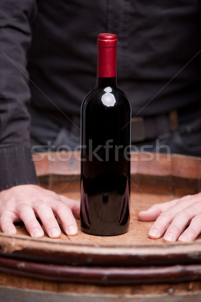 bottle of red wine and hands of a man Stock photo © Giulio_Fornasar