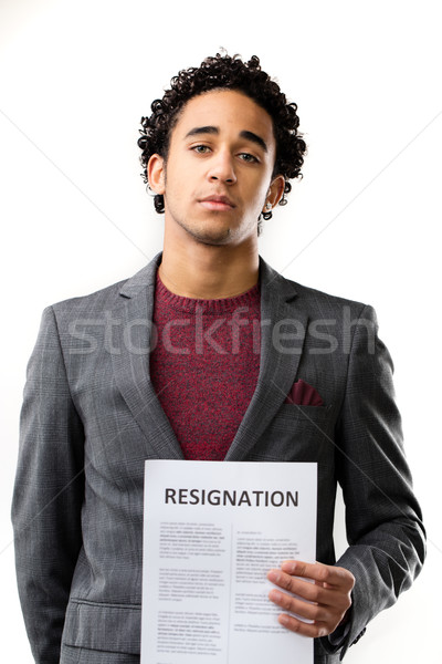 Stock photo: resignation sheet in young man's hand