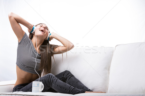 woman singing and listening to music at home Stock photo © Giulio_Fornasar