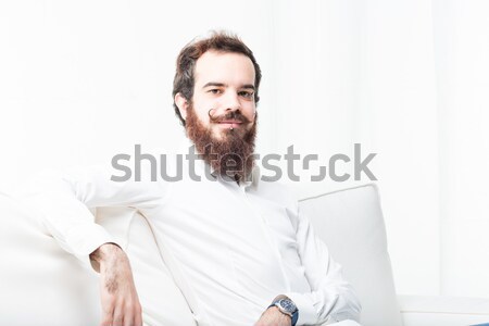 молодые современных человека диване молодым человеком борода Сток-фото © Giulio_Fornasar
